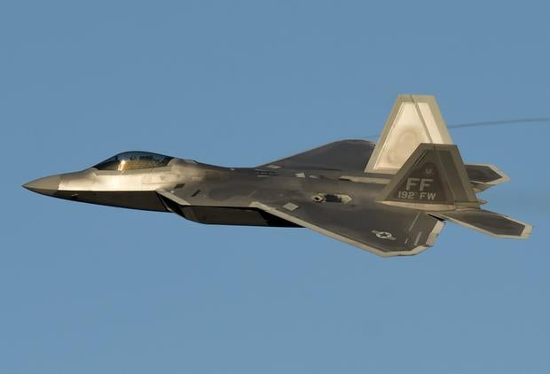A US Air Force Lockheed Martin F-22 Raptor stealth fighter aircraft performs a demonstration