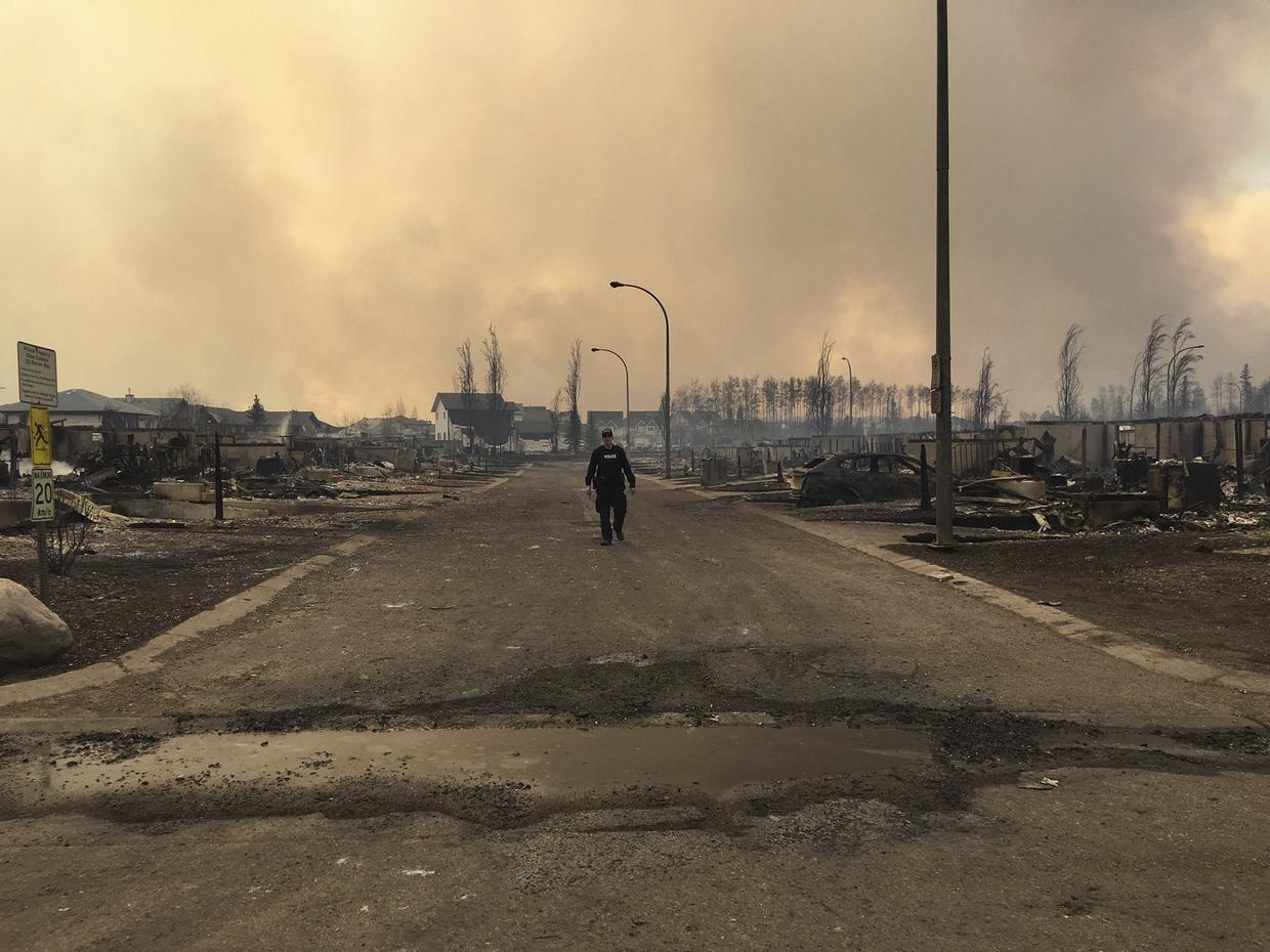 Crews race against time battling enormous Canada wildfire CBS News