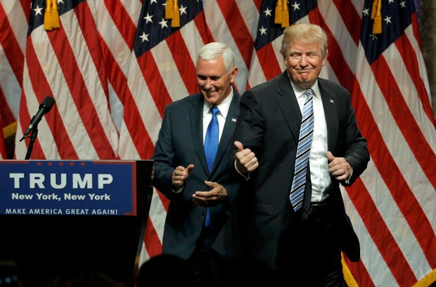 Republican presidential candidate Donald Trump points to Indiana Gov. Mike Pence after introducing Pence as his vice presidential running mate in New York City July 16, 2016.