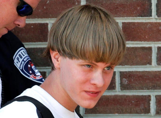 Police lead suspected shooter Dylann Roof into the courthouse in Shelby, North Carolina, on June 18, 2015.