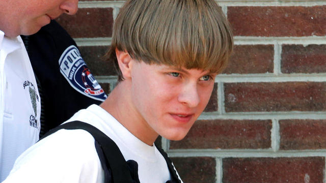Police lead suspected shooter Dylann Roof into the courthouse in Shelby, North Carolina, on June 18, 2015. 