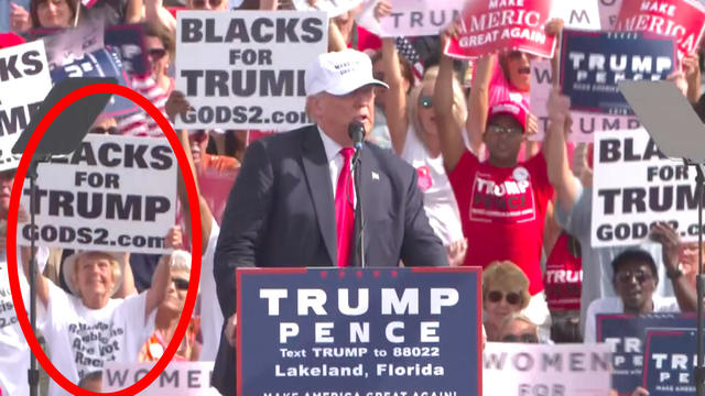 White woman holds "Blacks for Trump" sign at Florida rally - CBS News