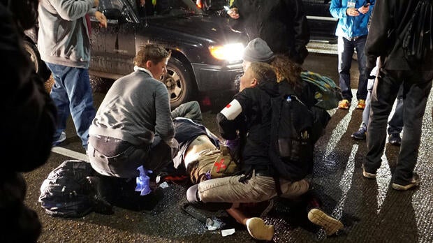 A demonstrator is treated for a gunshot wound during a protest against the election of Republican Donald Trump as president of the United States in Portland, Oregon, Nov. 12, 2016.