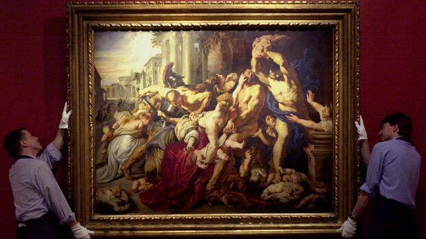 Sotheby’s staff display “The Massacre of the Innocents” by Sir Peter Paul Rubens (1577-1640), painted between 1609 and 1611, at Sotheby’s in London July 5, 2002.