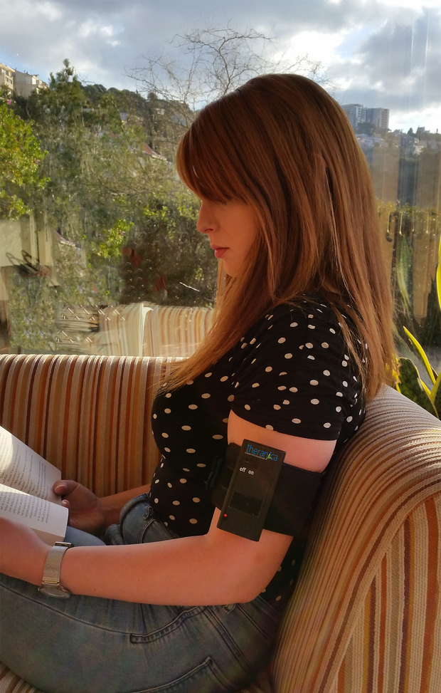 woman-with-migraine-arm-patch.png