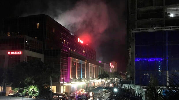 Smoke rises from the Resorts World Manila complex early June 2, 2017, in Manila, Philippines.