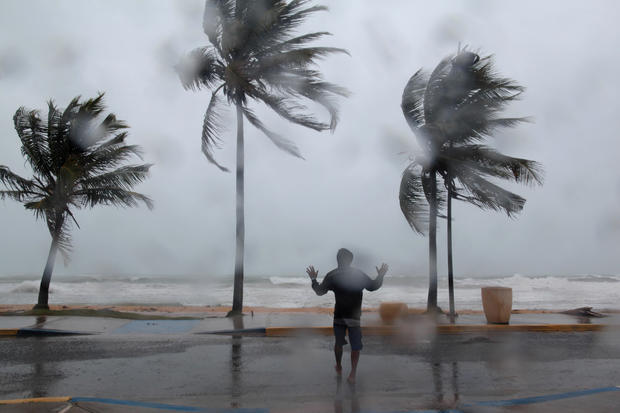 A man reacts in the winds and rain in Luquillo as Hurricane Irma slammed across islands in the northern Caribbean 
