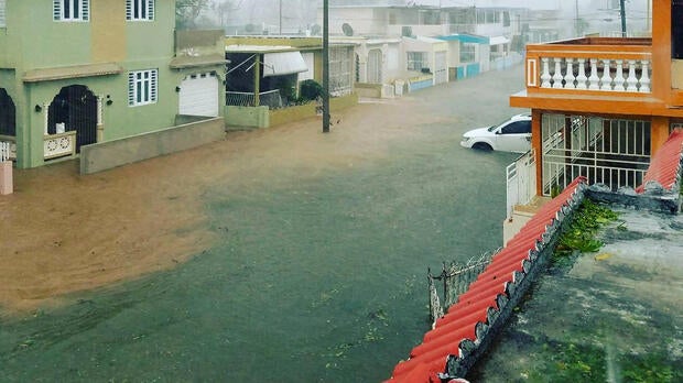 A flooded road is seen after Hurricane Maria hit Puerto Rico Sept. 20, 2017, in this still image taken from social media.