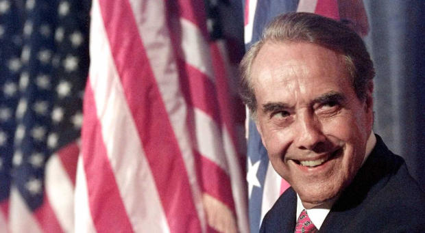 U.S. Republican presidential candidate Bob Dole looks back over his shoulder as he waits to be introduced during a "GOP Unity" rally in Savannah, Ga., on Flag Day, June 14, 1996. 