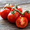 Fresh tomatoes on wood background 