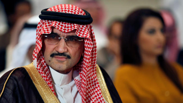 FILE PHOTO - Saudi billionaire Prince AlWaleed bin Talal looks on during a news briefing in Manama 