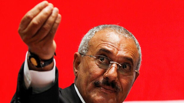 Yemen's then-President Ali Abdullah Saleh gestures during a gathering of supporters in Sanaa Feb. 20, 2011.