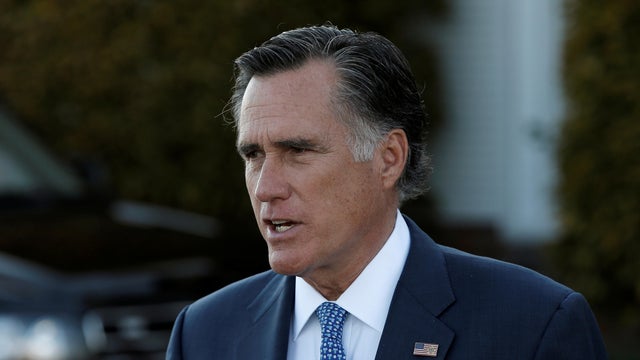 FILE PHOTO: Former Massachusetts Governor Mitt Romney speaks to members of the media at Trump National Golf Club in Bedminster 