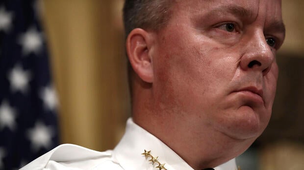 Baltimore Police Department Commissioner Kevin Davis listens to a question during a press conference at City Hall highlighting a Justice Department investigation into the Baltimore City Police Department Aug. 10, 2016, in Baltimore, Maryland.