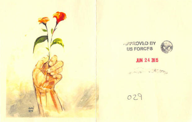 ansi-hand-holding-red-flowers-with-us-forces-stamp.jpg 