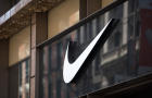 The Nike "swoosh" logo is displayed on the outside of the Nike SoHo store June 15, 2017, in New York City. 