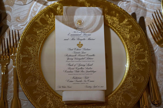 A place setting for the State Dinner for French President Emmanuel Macron is shown in the State Dining Room of the White House in Washington 