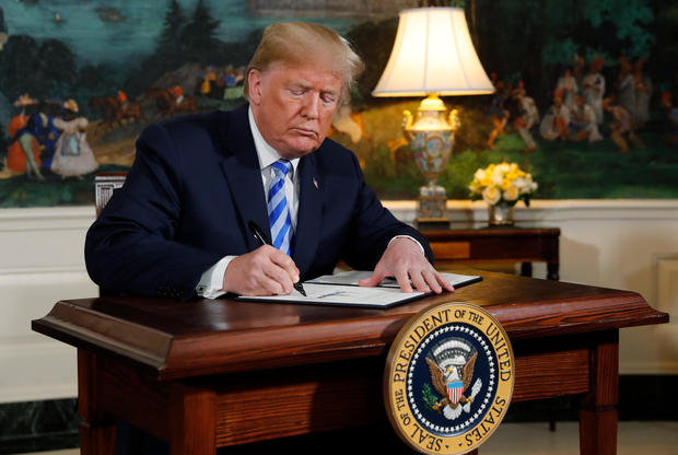 U.S. President Donald Trump signs a proclamation announcing his intention to withdraw from the JCPOA Iran nuclear agreement at the White House in Washington 