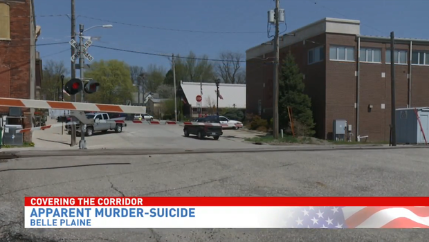 Authorities say Iowa mom pulled son, 8, into path of train in murder