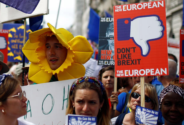 EU supporters, calling on the government to give Britons a vote on the final Brexit deal, participate in the 'People's Vote' march in central London 