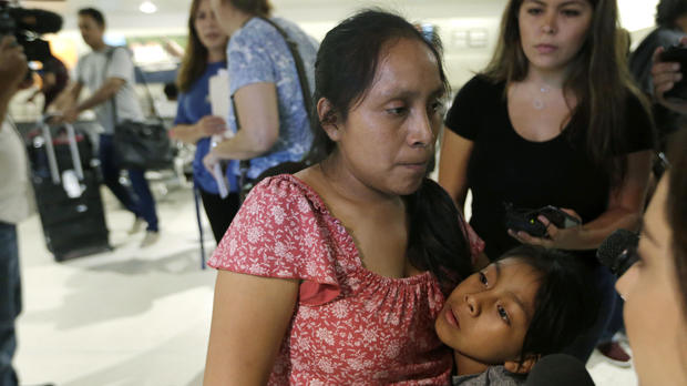 Buena Ventura Martin Godinez, left, hugs her daughter Janne after being reunited at Miami International Airport July 1, 2018, in Miami. 