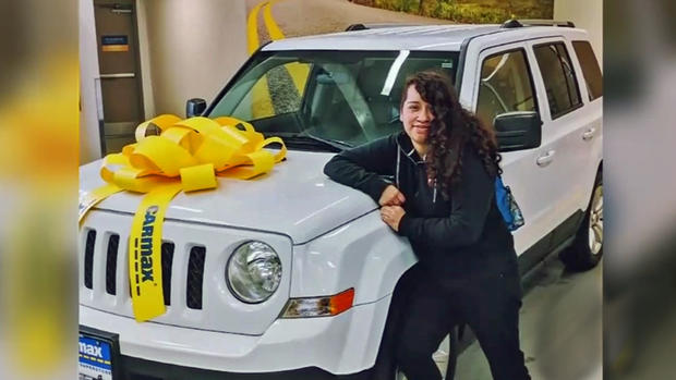 Angela Hernandez Poses with her Jeep 