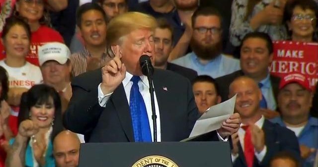 Trump reads lists of accomplishments from a piece of paper at rally