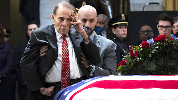Bob Dole at H.W. Bush casket 