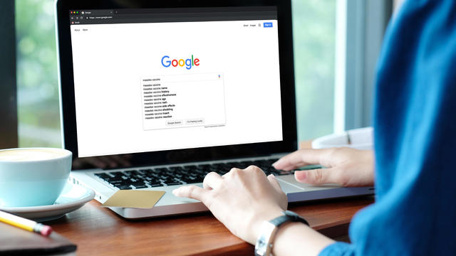 Woman on laptop computer Google search 