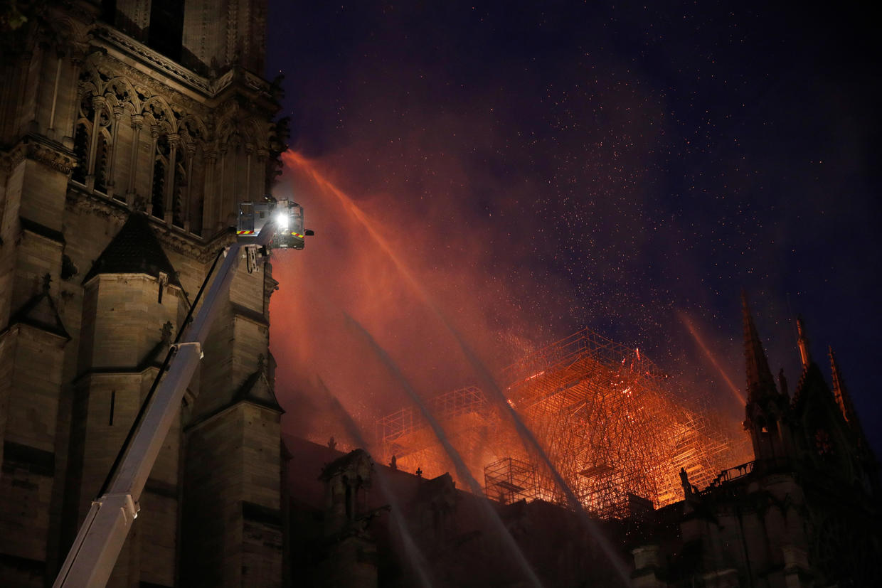 Inspecting the damage Fire burns Notre Dame Cathedral in Paris