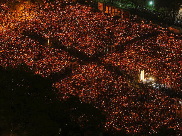 FILE PHOTO: Tens of thousands of people participate in a candlelight vigil at Hong Kong's Victoria Park 