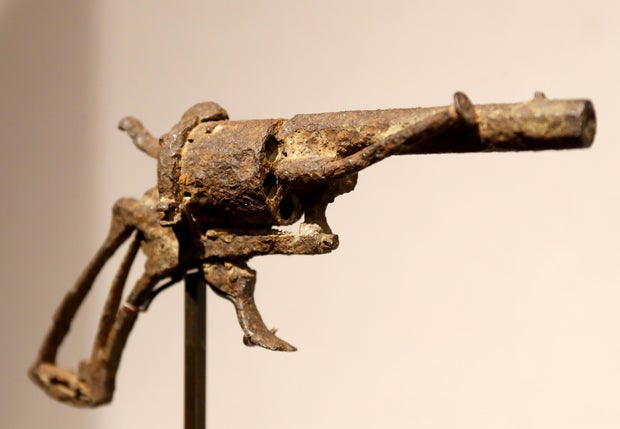 A revolver believed to be the gun Dutch 19th century painter Vincent van Gogh used to kill himself on July 27, 1890, is seen on display at Paris' Drouot auction house on June 19, 2019.