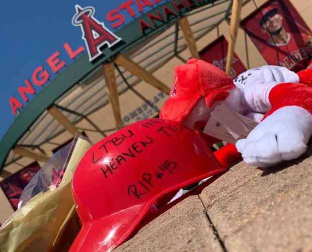 People leave mementos in memory of Tyler Skaggs in front of Angels Stadium 