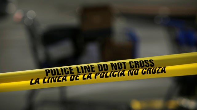 A police cordon is seen after a mass shooting at a Walmart in El Paso