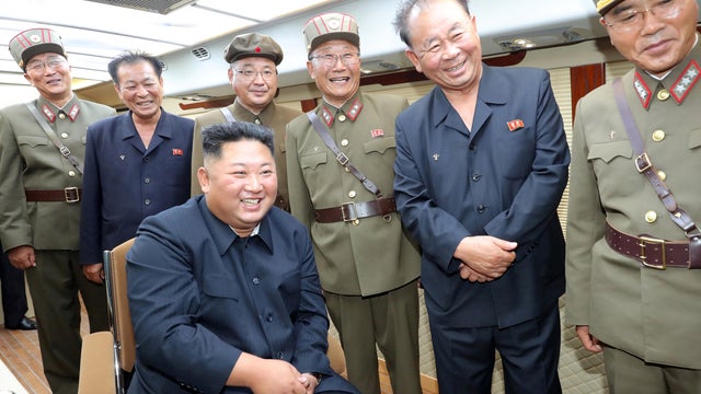 KCNA picture of North Korean leader Kim Jong Un guiding the test firing of a new weapon