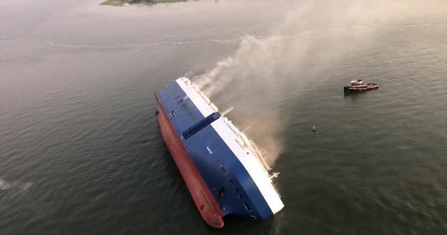 4 remain missing after giant cargo ship capsizes off coast