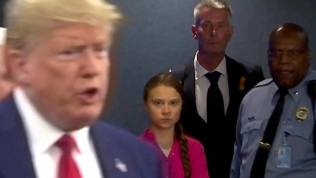 Swedish environmental activist Greta Thunberg watches as U.S. President Donald Trump enters the United Nations 