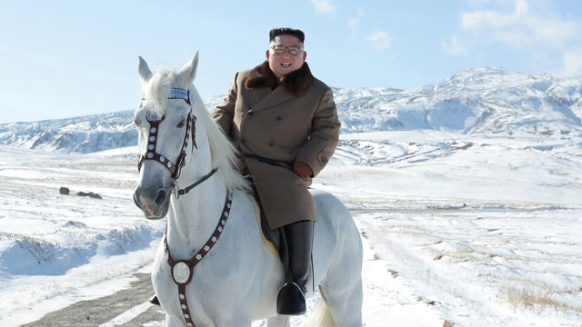 North Korean leader Kim Jong Un rides a horse during snowfall in Mount Paektu
