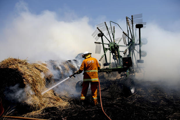 Country Fire Service (CFS) members put out a fire which reached hay bales on a property at Mount Torrens in the Adelaide Hills 