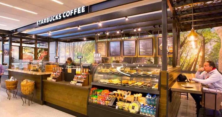 Airport Starbucks stores pay black workers less than whites, union group claims