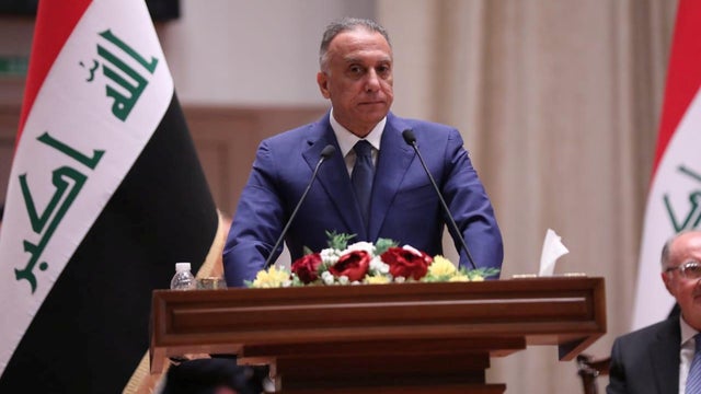 Iraqi Prime Minister-designate Mustafa al-Kadhimi delivers a speech during the vote on the new government at the parliament headquarters in Baghdad