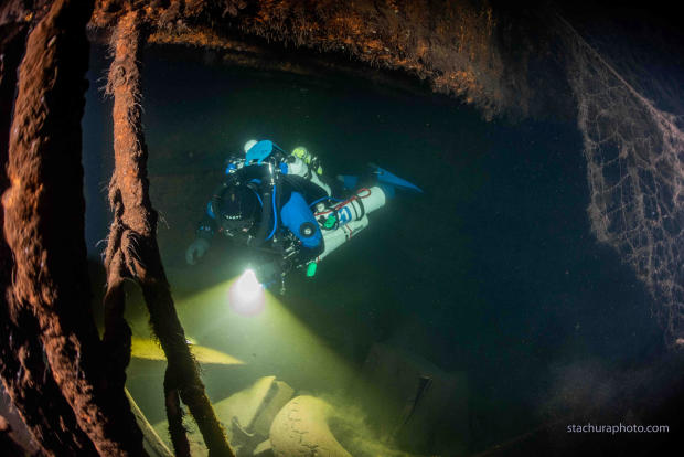 A diver checks the wreck of a German Second World War ship "Karlsruhe" during a search operation in the Baltic sea 