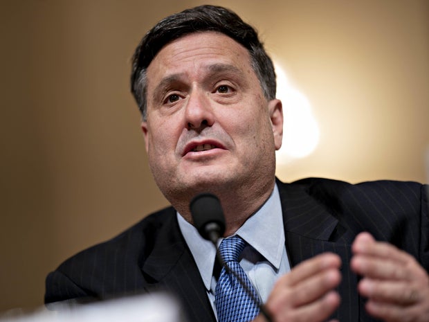 Ebola Response Coordinator Ron Klain listens to U.S. Vice President Joe Biden as they meet with organization leaders that are responding to the Ebola crisis while in the Eisenhower Executive Office Building on the White House complex in Washington 