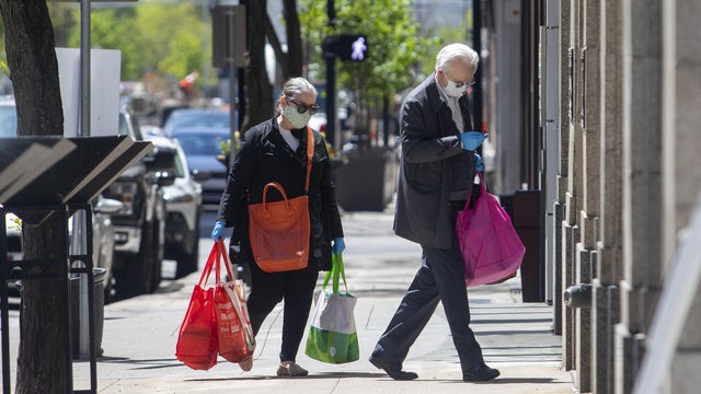 Optimistic Family Selfie during Coronavirus Emergency. All Wearing Protective Face Mask 