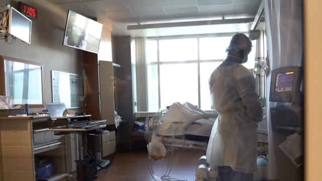 A medical staff member is seen inside a hospital. 