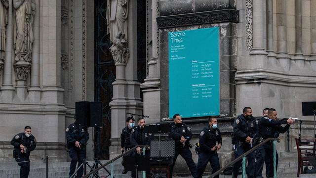 Police officers are seen outside the Cathedral Church of St. John the Divine after a man opened fire outside the church in Manhattan 