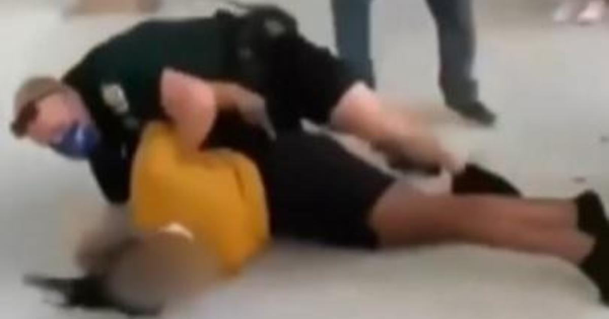 Video shows a school worker knocking a Florida high school student to the ground