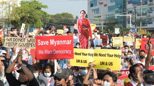 Worldview Myanmar Protesters Fight On Ebola Epidemic Reemerges Glass Ceiling Shattered At Wto Cbs News