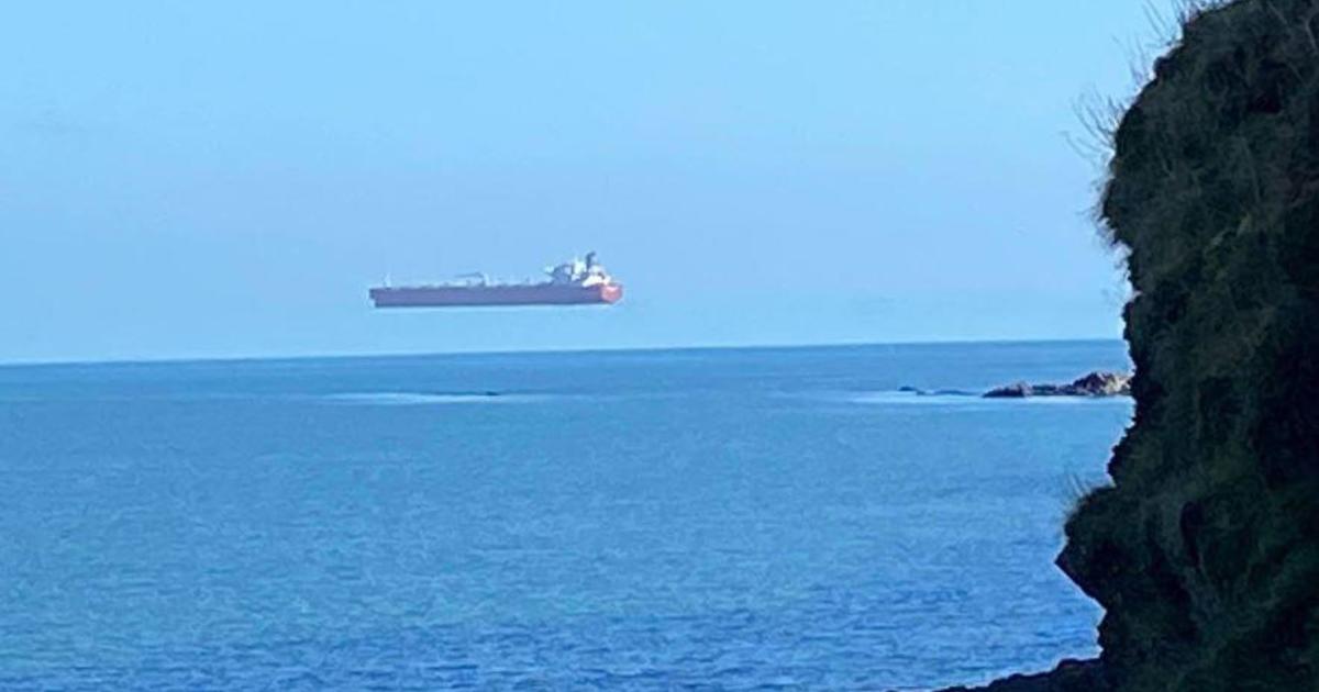 Photos Appear To Show A Giant Ship Hovering Over The Water Off The English Coast Cbs News