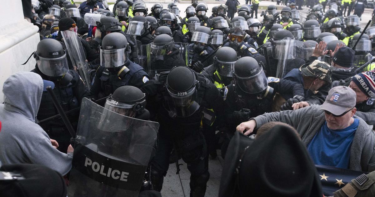 Riots suspect Capitol accused of assaulting police and badge of officer in his backyard